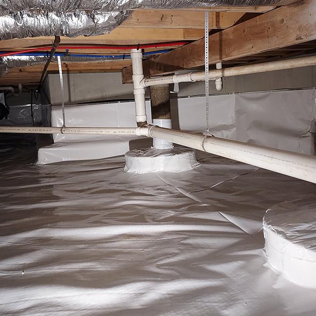 Crawl Space after full encapsulation with vapor barrier: clean, dry, and protected